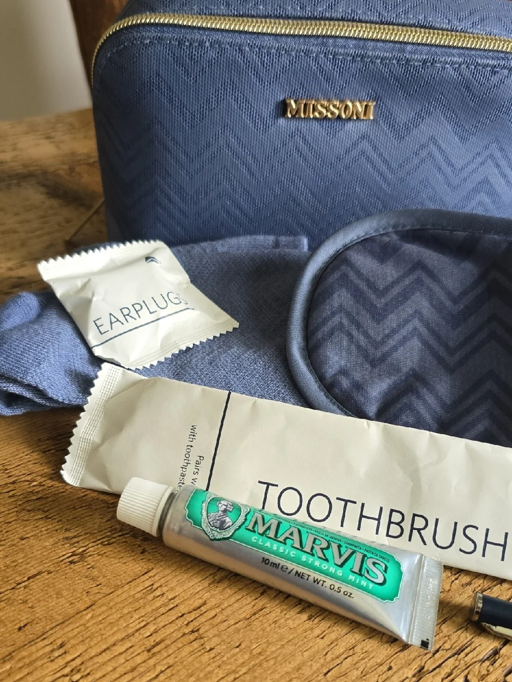 Missoni Blue Chevron Pouch with Gold Accents, Filled With Travel Essentials.